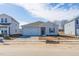 Newly constructed home with gray siding, two-car garage, and landscaping at 511 White Birch Ln, Angier, NC 27501