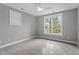 Spacious bedroom with ceiling fan and large window at 520 S Bloodworth St, Raleigh, NC 27601