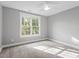 Well-lit bedroom with large window and ceiling fan at 520 S Bloodworth St, Raleigh, NC 27601