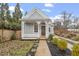 Lovely gray home with inviting covered porch, charming architectural details, and manicured landscaping at 520 S Bloodworth St, Raleigh, NC 27601