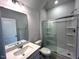 Bathroom featuring double sink vanity, large mirror, and shower at 60 Cordoba Dr, Franklinton, NC 27525