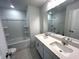 Bathroom featuring double sink vanity, large mirror, and shower/tub combo at 60 Cordoba Dr, Franklinton, NC 27525