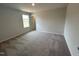 Spacious carpeted bedroom features a large window and neutral paint, perfect for relaxation at 60 Cordoba Dr, Franklinton, NC 27525