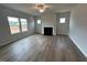 Living room with a fireplace and large windows at 60 Cordoba Dr, Franklinton, NC 27525