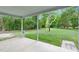 View from the covered back porch overlooking the lush, green yard at 621 Shepard School Rd, Zebulon, NC 27597