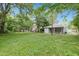 Exterior view of home, showcasing a large backyard with mature trees at 621 Shepard School Rd, Zebulon, NC 27597