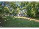 Spacious backyard with mature trees and grassy lawn at 621 Shepard School Rd, Zebulon, NC 27597