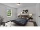Inviting bedroom featuring a cozy bed, modern decor, and bright natural light at 621 Shepard School Rd, Zebulon, NC 27597