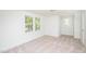 Cozy carpeted bedroom with ample closet space and windows at 621 Shepard School Rd, Zebulon, NC 27597