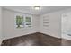 Bright bedroom featuring hardwood floors, large windows, and neutral walls at 621 Shepard School Rd, Zebulon, NC 27597