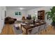 Charming dining room and living room featuring stylish decor and an abundance of natural light at 621 Shepard School Rd, Zebulon, NC 27597