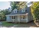 Cute blue house with a front porch at 621 Shepard School Rd, Zebulon, NC 27597