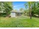 Charming exterior view of a single story home with covered back porch and green front yard at 621 Shepard School Rd, Zebulon, NC 27597