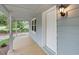 Detailed view of the covered front porch with white trim and a wooden floor at 621 Shepard School Rd, Zebulon, NC 27597