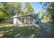 Side view of the house showcasing backyard at 621 Shepard School Rd, Zebulon, NC 27597