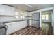 Modern kitchen features stainless steel appliances and wood flooring at 621 Shepard School Rd, Zebulon, NC 27597
