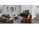 Comfortable living room featuring large windows and modern furnishings at 621 Shepard School Rd, Zebulon, NC 27597