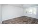 Bright living room with hardwood floors and large window at 621 Shepard School Rd, Zebulon, NC 27597
