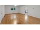Open living room with hardwood floors, neutral paint, and bright natural light at 621 Shepard School Rd, Zebulon, NC 27597