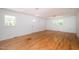 Large living area with hardwood floors and plenty of natural light at 621 Shepard School Rd, Zebulon, NC 27597