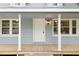 Close-up of the front porch with classic columns and a welcoming entrance at 621 Shepard School Rd, Zebulon, NC 27597