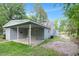 View of the back of the house featuring an attached carport and spacious yard at 621 Shepard School Rd, Zebulon, NC 27597