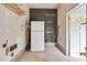 Unfinished storage area with shelving and refrigerator at 621 Shepard School Rd, Zebulon, NC 27597