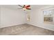 Bright bedroom with ceiling fan and window coverings at 6390 Cane Creek Rd, Snow Camp, NC 27349