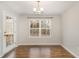 Bright dining room with wood floors and a view of the backyard at 6390 Cane Creek Rd, Snow Camp, NC 27349