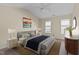 Spacious bedroom with ceiling fan and large windows at 717 E Holding Ave, Wake Forest, NC 27587