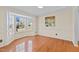 Bright dining room with hardwood floors and bay window at 717 E Holding Ave, Wake Forest, NC 27587