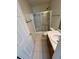Bathroom with shower/tub combo and wood vanity at 7309 Brighton Hill Ln, Raleigh, NC 27616