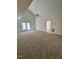Spacious living room with high ceilings and neutral carpet at 7309 Brighton Hill Ln, Raleigh, NC 27616