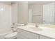 Clean bathroom featuring a combined shower-tub, neutral walls, white tile, and a single vanity at 749 Swan Neck Ln, Raleigh, NC 27615