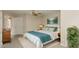 Comfortable bedroom featuring neutral walls, carpet, and a ceiling fan, styled with serene decor and a teal throw at 749 Swan Neck Ln, Raleigh, NC 27615