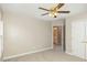 Neutral carpeted bedroom with open access to an en-suite bathroom and a double door closet at 749 Swan Neck Ln, Raleigh, NC 27615