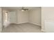 Spacious carpeted bedroom showcasing neutral walls, a ceiling fan, and double doors for easy access at 749 Swan Neck Ln, Raleigh, NC 27615