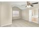 Spacious bedroom with a ceiling fan, natural light, and an ensuite bathroom at 749 Swan Neck Ln, Raleigh, NC 27615