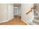 Light and bright entryway with stairs and wood-look floors at 749 Swan Neck Ln, Raleigh, NC 27615