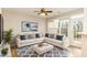 Bright living room featuring a comfortable sectional sofa, stylish decor, and plenty of natural light at 749 Swan Neck Ln, Raleigh, NC 27615