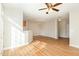 Spacious living room featuring wood floors, a ceiling fan, and ample natural light at 749 Swan Neck Ln, Raleigh, NC 27615