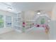 Bright playroom featuring built-in shelving units and a carpeted floor at 81409 Alexander, Chapel Hill, NC 27517