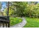Landscaped backyard with firepit and stone pathway at 816 Peyton St, Raleigh, NC 27610