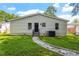 House exterior showcasing a backyard with a stone pathway at 816 Peyton St, Raleigh, NC 27610