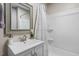 Clean bathroom with vanity, sink, and shower bathtub combo at 816 Peyton St, Raleigh, NC 27610