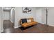 Common area with brown couch, and coat rack at 816 Peyton St, Raleigh, NC 27610