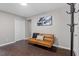 Common area with brown couch, and coat rack at 816 Peyton St, Raleigh, NC 27610