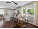 Modern dining area with marble table, gold chairs, and large windows at 816 Peyton St, Raleigh, NC 27610