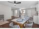 Bright dining area with marble table, gold chairs, and kitchen access at 816 Peyton St, Raleigh, NC 27610