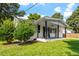 Front view of a charming white brick ranch house with a covered porch at 816 Peyton St, Raleigh, NC 27610